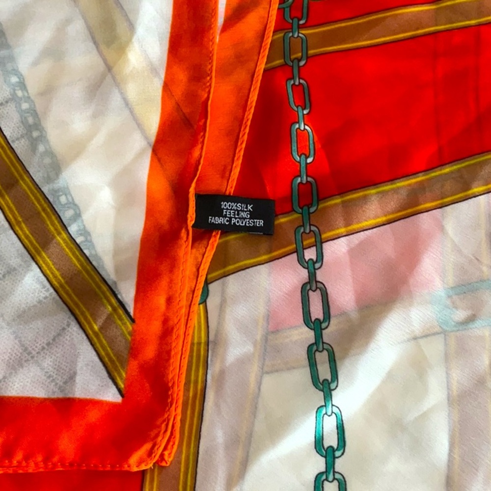 Oversized silk feel scarf/wrap. Chains and belts pattern. 34” by 72”.